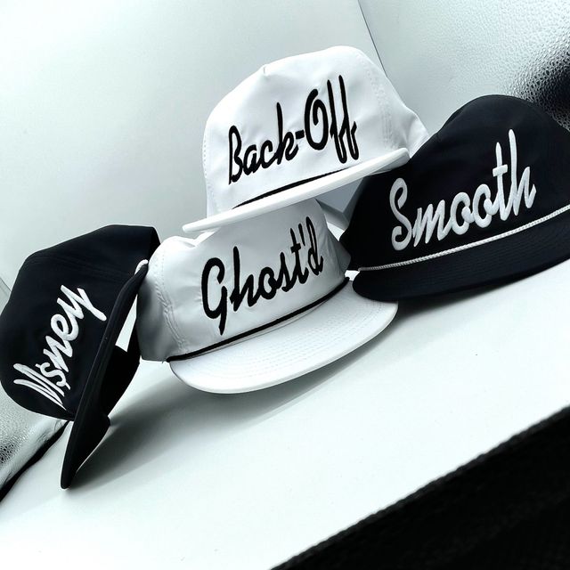 Black and white rope caps with raised script embroidery reading Back-Off, Ghost'd and Smooth